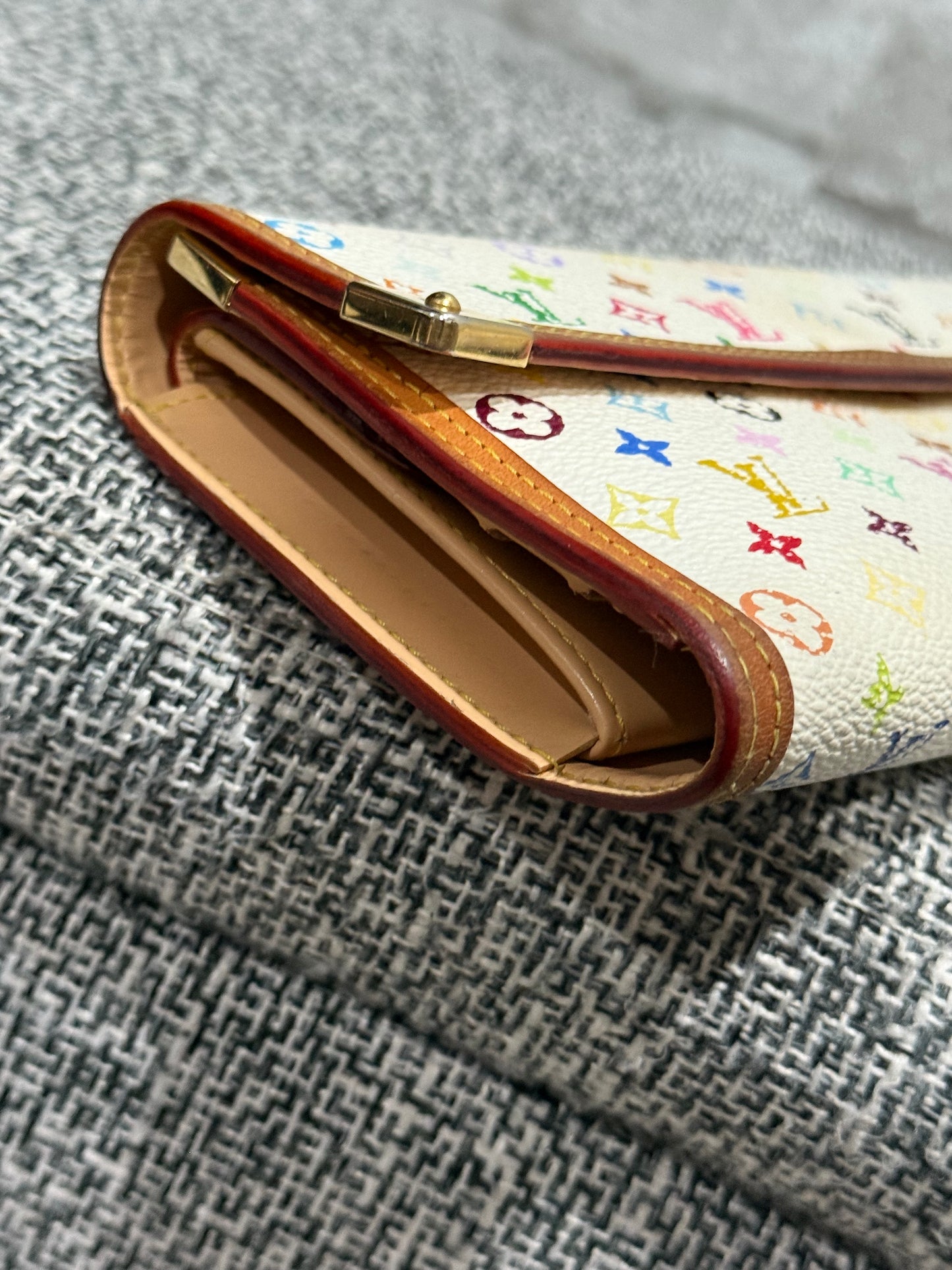 The style is limitless with this vintage Louis Vuitton 2004  limited edition of the Takashi Murakami Wallet
