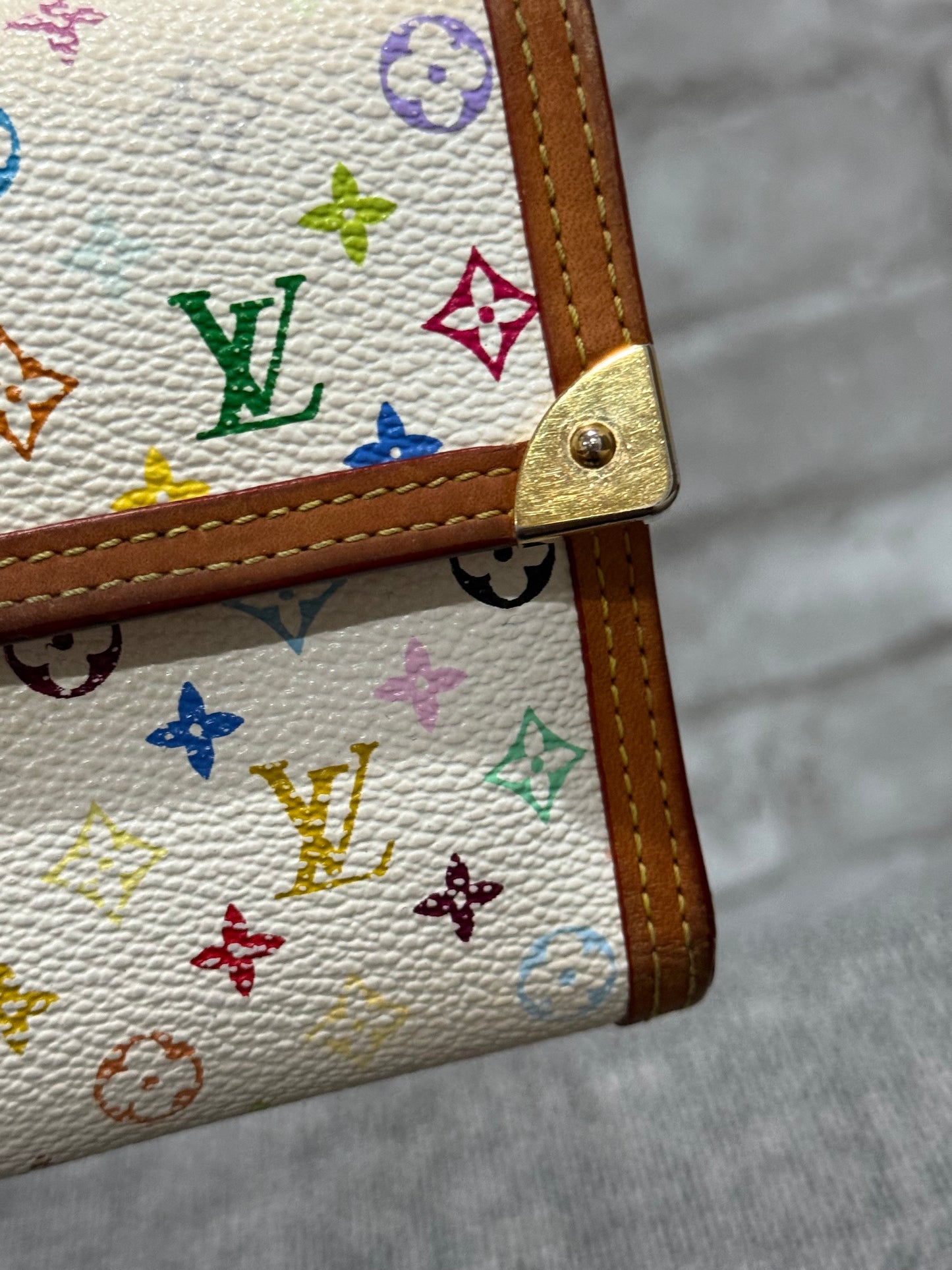 The style is limitless with this vintage Louis Vuitton 2004  limited edition of the Takashi Murakami Wallet