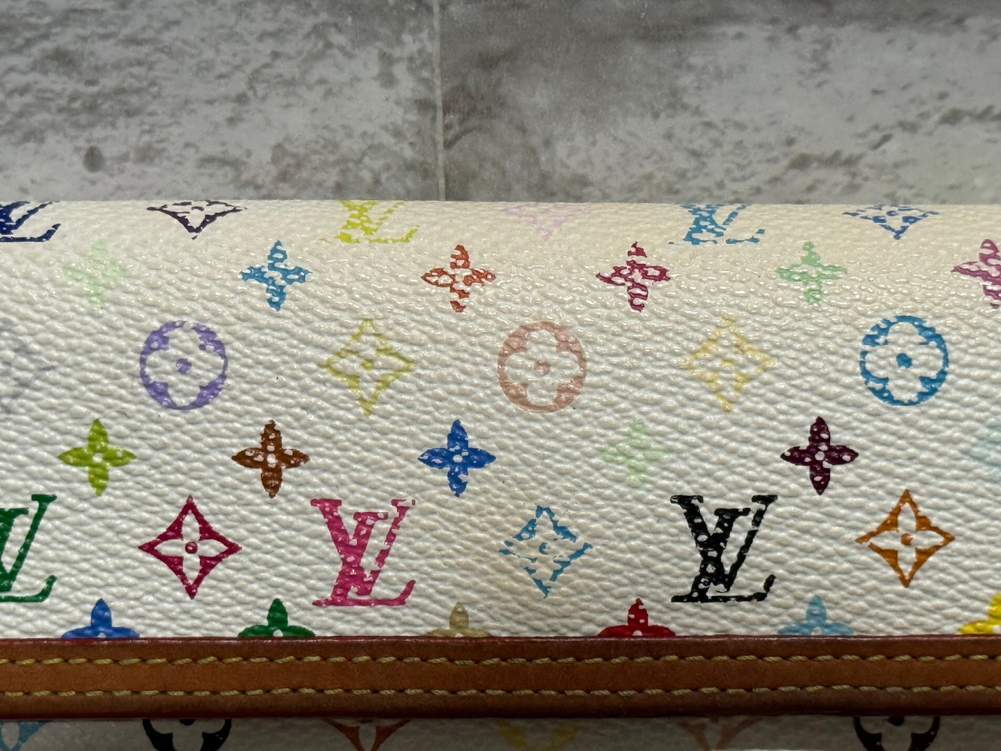 The style is limitless with this vintage Louis Vuitton 2004  limited edition of the Takashi Murakami Wallet