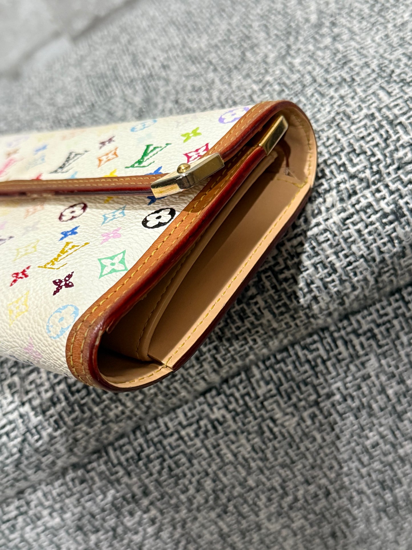 The style is limitless with this vintage Louis Vuitton 2004  limited edition of the Takashi Murakami Wallet